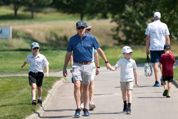 Father and son walk together during The Pinnacle Bank Championship