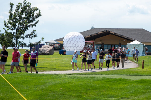 Alex Schaake group walking during The Pinnacle Bank Championship