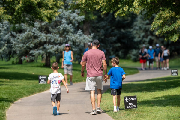 Family walks together during The Pinnacle Bank Championship