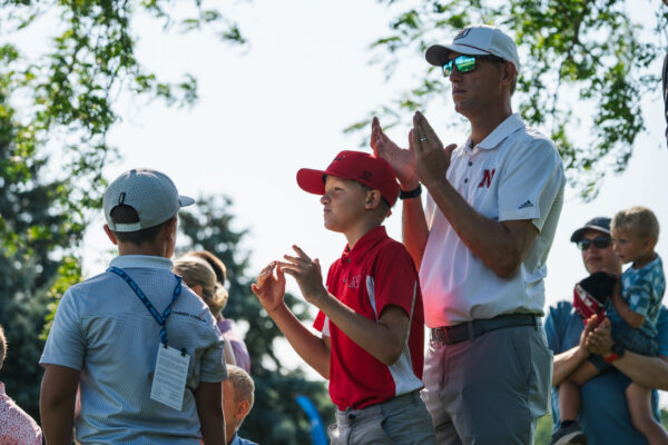 Spectators applaud golfers during the Pinnacle Bank Championship