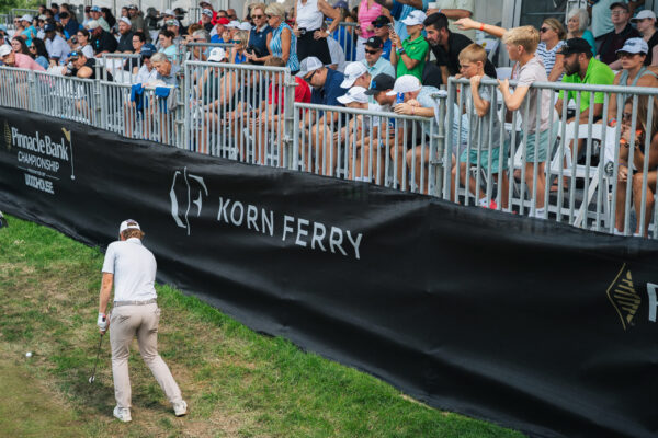 Austin Hitt attempts a shot from the mud during the Pinnacle Bank Championship