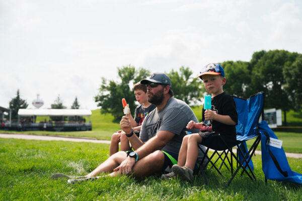 Spectators eating popsicles during the Pinnacle Bank Championship